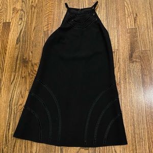 Trina Turk elegant black dress. Knee length. Sleeveless. Cutout detail. Sz 4